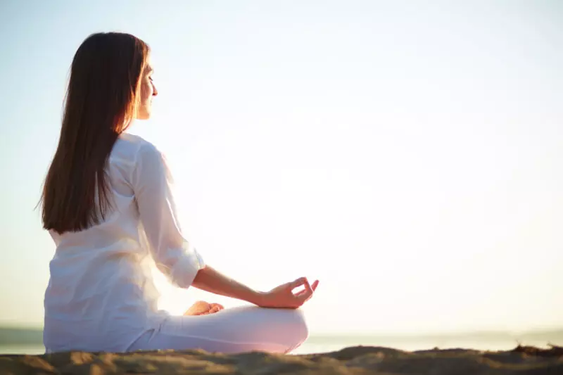 6 Powerful Exercises for Anxiety Relief and Relaxation woman sitting yoga pose beach 800x533 1
