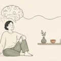 Minimalist doodle of a calm person, a simple shelf and a line drawing of a brain leading from excess possessions toward a heart